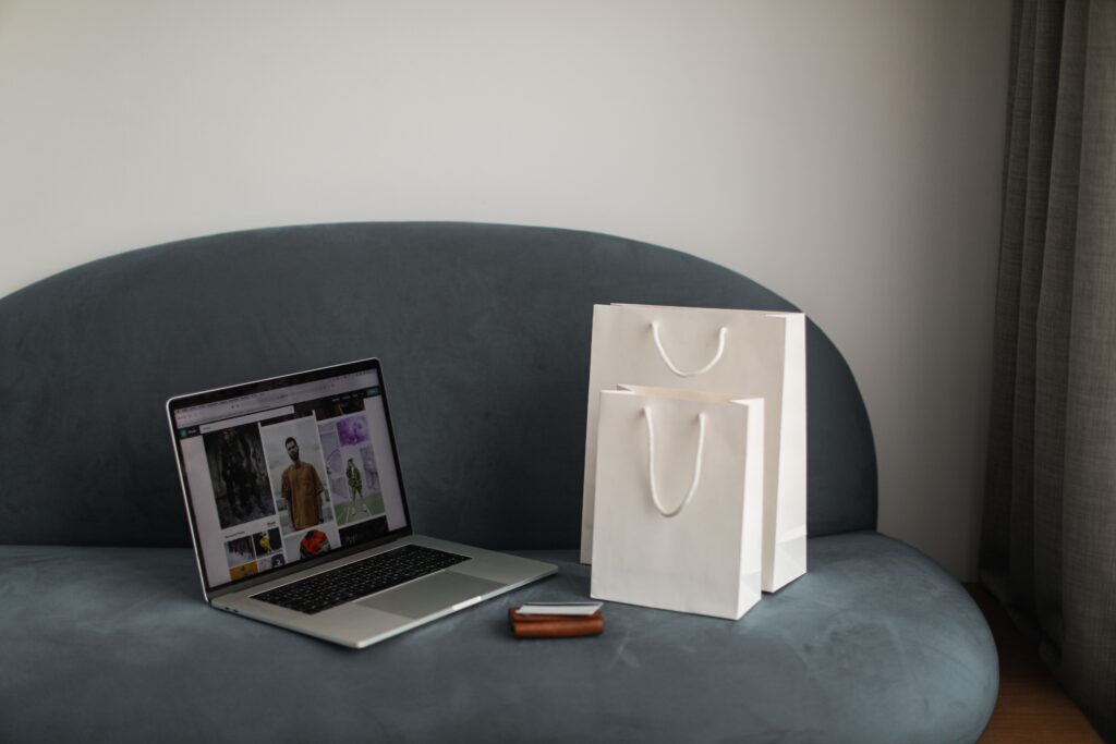 Comparing e-commerce platforms like WooCommerce and Shopify on a modern workspace laptop