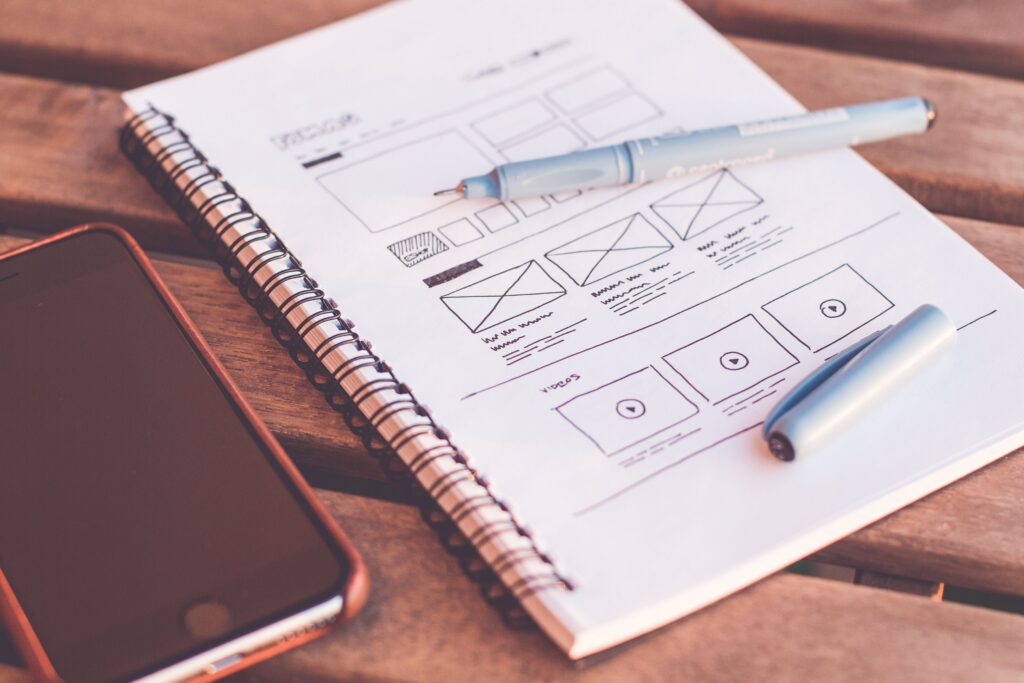 Custom web design wireframe and conversion rate optimization metrics on a modern screen.